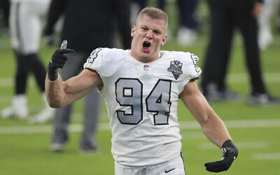 Las Vegas Raiders defensive end Carl Nassib (94) celebrates after the Las Vegas Raiders holds on to defeat the Los Angeles Chargers on the last play of the game during an NFL football game, Sunday, November 8, 2020, in Inglewood, Calif. (AP Photo/Peter Joneleit)