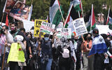 Demonstrators march to the Israeli Consulate during a protest against Israel and in support of Palestinians on May 15, 2021, in the Westwood section of Los Angeles. (AP Photo/Ringo H.W. Chiu)