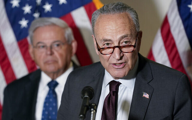 US Senate Majority Leader Chuck Schumer of New York (right) speaks on Capitol Hill in Washington, on May 18, 2021. Sen. Bob Menendez (left) listens. (AP Photo/Susan Walsh) US Senate Majority Leader Chuck Schumer of New York (right) speaks on Capitol Hill in Washington, on May 18, 2021. Sen. Bob Menendez (left) listens. (AP Photo/Susan Walsh)