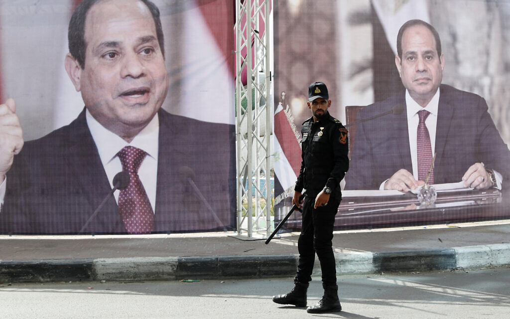 A Hamas police officer stands guards at the main square in front of large portraits of Egyptian President Abdel Fattah el-Sissi, while Hamas leaders meet with Egypt's intelligence chief Abbas Kamel, unseen, in Gaza City, May 31, 2021. (AP Photo/Adel Hana) A Hamas police officer stands guards at the main square in front of large portraits of Egyptian President Abdel Fattah el-Sissi, while Hamas leaders meet with Egypt's intelligence chief Abbas Kamel, unseen, in Gaza City, May 31, 2021. (AP Photo/Adel Hana)