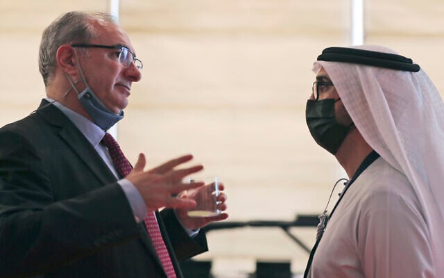 Israel's ambassador to the UAE, Eitan Na'eh, left, talks with an Emirati official during the Global Investment Forum in Dubai, United Arab Emirates on June 2, 2021. (AP/Kamran Jebreili) Israel's ambassador to the UAE, Eitan Na'eh, left, talks with an Emirati official during the Global Investment Forum in Dubai, United Arab Emirates on June 2, 2021. (AP/Kamran Jebreili)