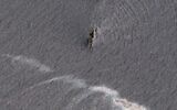 Oil-slicked waters spread out from the partially sunk Iranian navy vessel Kharg in the Gulf of Oman off the coast of Jask, Iran, in this Thursday, June 3, 2021, satellite photo from Planet Labs Inc. (Planet Labs Inc. via AP)