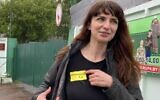 In this Wednesday, May 19, 2021 file photo, Belarusian journalist Katsiaryna Barysevich, who was sentenced to six months over her investigation into a protester's death, shows her yellow prison's label to colleagues upon her release from the prison in Komarovka, Belarus (AP Photo)