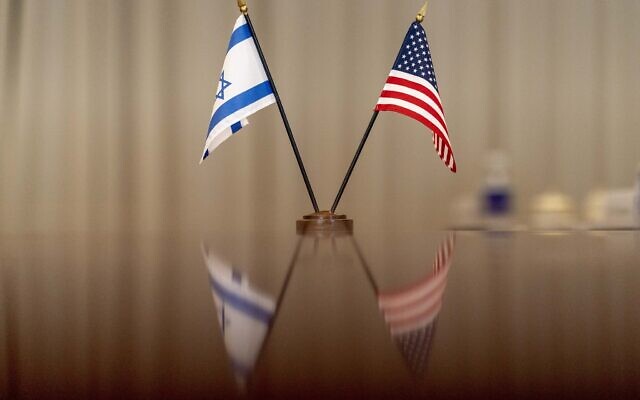 Illustrative: Israeli and American flags are visible on the table as US Secretary of Defense Lloyd Austin hosts a bilateral meeting with Defense Minister Benny Gantz at the Pentagon in Washington on June 3, 2021. (AP Photo/Andrew Harnik) Illustrative: Israeli and American flags are visible on the table as US Secretary of Defense Lloyd Austin hosts a bilateral meeting with Defense Minister Benny Gantz at the Pentagon in Washington on June 3, 2021. (AP Photo/Andrew Harnik)