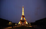 The Eiffel Tower is illuminated in Paris, Tuesday, May 25, 2021. France is putting itself back on the menu as a destination for international tourists who have had coronavirus jabs. (AP Photo/Francois Mori)