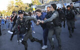 Israeli forces arrest Al Jazeera journalist, Givara Budeiri, during a protest in the east Jerusalem neighborhood of Sheikh Jarrah, June 5, 2021. (AP Photo/Oren Ziv)