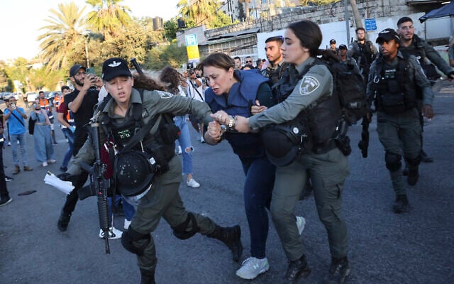 Israeli forces arrest Al Jazeera journalist, Givara Budeiri, during a protest in the east Jerusalem neighborhood of Sheikh Jarrah, June 5, 2021. (AP Photo/Oren Ziv) Israeli forces arrest Al Jazeera journalist, Givara Budeiri, during a protest in the east Jerusalem neighborhood of Sheikh Jarrah, June 5, 2021. (AP Photo/Oren Ziv)
