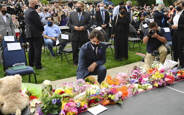 Canada's Prime Minister Justin Trudeau lays flowers at a vigil outside the London Muslim Mosque for the victims of the deadly vehicle attack on five members of the Canadian Muslim community in London, Ontario, June 8, 2021. (Nathan Denette/The Canadian Press via AP) Canada's Prime Minister Justin Trudeau lays flowers at a vigil outside the London Muslim Mosque for the victims of the deadly vehicle attack on five members of the Canadian Muslim community in London, Ontario, June 8, 2021. (Nathan Denette/The Canadian Press via AP)