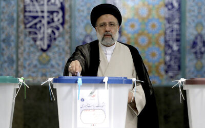Ebrahim Raisi casts his vote at a polling station in Tehran, Iran, June 18, 2021. (AP Photo/Ebrahim Noroozi)