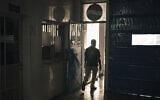 A Palestinian employee walks at the Pepsi bottling plant in Gaza City, June 21, 2021. (AP Photo/Felipe Dana)
