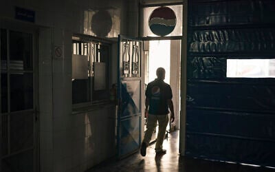 A Palestinian employee walks at the Pepsi bottling plant in Gaza City, June 21, 2021. (AP Photo/Felipe Dana)