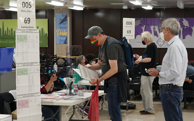 Voters receive their ballots at Frank McCourt High School, in New York, Tuesday, June 22, 2021. (AP/Richard Drew) Voters receive their ballots at Frank McCourt High School, in New York, Tuesday, June 22, 2021. (AP/Richard Drew)