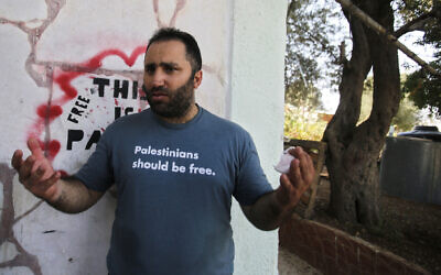 Prominent Palestinian activist Issa Amro speaks after his release from Palestinian Authority detention, in the West Bank city of Hebron, on September 10, 2017.  (AP/Nasser Shiyoukhi, File)