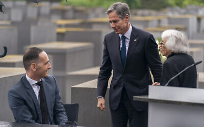 Holocaust Survivor Margot Friedlander, right, is greeted by US Secretary of State Antony Blinken, center, and German Minister of Foreign Affairs Heiko Maas, left, after speaking at a ceremony for the launch of a US-Germany Dialogue on Holocaust Issues at the Memorial to the Murdered Jews of Europe in Berlin, June 24, 2021. (AP Photo/Andrew Harnik, Pool)