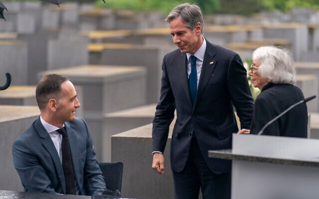 Holocaust Survivor Margot Friedlander, right, is greeted by US Secretary of State Antony Blinken, center, and German Minister of Foreign Affairs Heiko Maas, left, after speaking at a ceremony for the launch of a US-Germany Dialogue on Holocaust Issues at the Memorial to the Murdered Jews of Europe in Berlin, June 24, 2021. (AP Photo/Andrew Harnik, Pool)