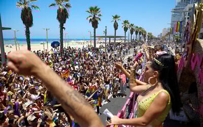 People participate in the annual Pride Parade, in Tel Aviv, Israel, Friday, June 25, 2021. (AP Photo/Ariel Schalit)