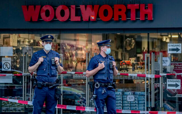 German police officers guard the crime scene in central Wuerzburg, Germany, June 26, 2021. (AP Photo/Michael Probst) German police officers guard the crime scene in central Wuerzburg, Germany, June 26, 2021. (AP Photo/Michael Probst)