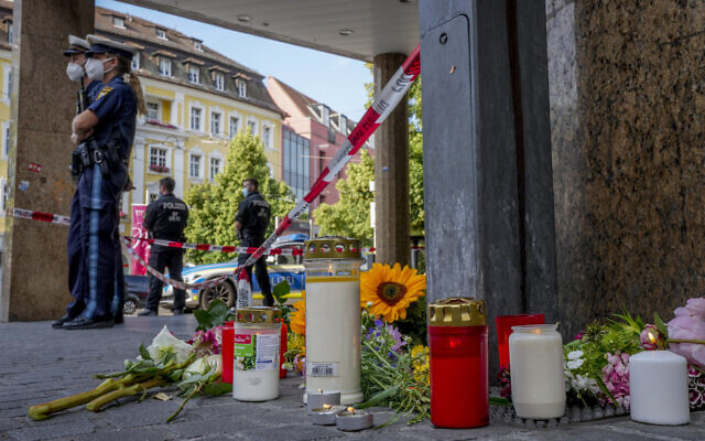 Flowers and candles laid at the scene of a deadly stabbing in central Wuerzburg, Germany, June 26, 2021. (Michael Probst/AP) Flowers and candles laid at the scene of a deadly stabbing in central Wuerzburg, Germany, June 26, 2021. (Michael Probst/AP)