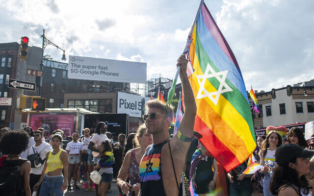 File - People gather during the Queer Liberation March in the West Village, June 27, 2021, in New York. (AP Photo/Brittainy Newman)
