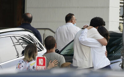 Family members of those missing from Champlain Towers South Condo collapse arrive back at the reunification center after visiting the scene in Surfside, Fla., Sunday, June 27, 2021. Rescuers keep digging through the mound of rubble and clinging to hope that someone could be found alive. (AP Photo/Marta Lavandier) Family members of those missing from Champlain Towers South Condo collapse arrive back at the reunification center after visiting the scene in Surfside, Fla., Sunday, June 27, 2021. Rescuers keep digging through the mound of rubble and clinging to hope that someone could be found alive. (AP Photo/Marta Lavandier)