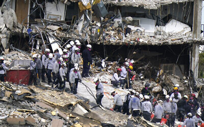 Rescue workers search in the rubble at the Champlain Towers South condominium, Monday, June 28, 2021, in the Surfside area of Miami. (AP/Lynne Sladky)