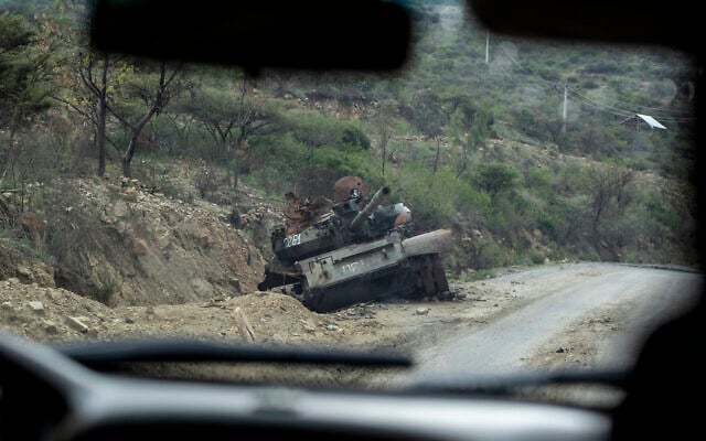 A destroyed tank sits by the side of a road leading to Abi Adi, in the Tigray region of northern Ethiopia in May 2021. (AP Photo/Ben Curtis) A destroyed tank sits by the side of a road leading to Abi Adi, in the Tigray region of northern Ethiopia in May 2021. (AP Photo/Ben Curtis)