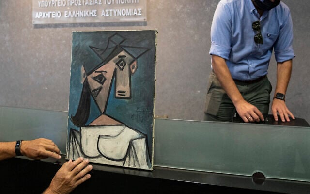 A cubist female bust by the Spanish painter Picasso is displayed by police officers in Athens during a press conference on June 29, 2021. (AP Photo/Petros Giannakouris) A cubist female bust by the Spanish painter Picasso is displayed by police officers in Athens during a press conference on June 29, 2021. (AP Photo/Petros Giannakouris)