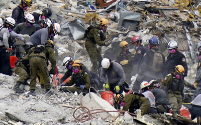 Crews from the United States and Israel work in the rubble of Champlain Towers South condo, in Surfside, Florida, June 29, 2021. (Lynne Sladky/AP)