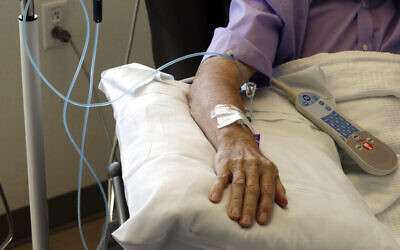 Chemotherapy is administered to a cancer patient. (AP Photo/Gerry Broome)