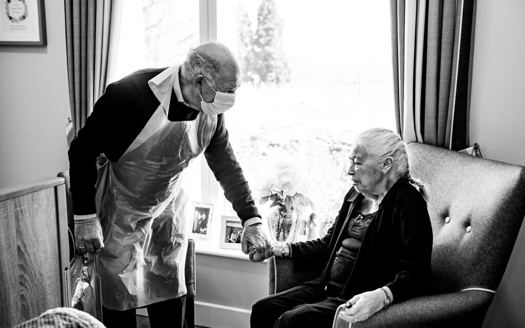 An image of Maureen and Eddie, an elderly couple reunited after a year’s separation due to COVID by Blake Ezra (Courtey Blake Ezra)