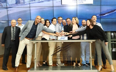 The Nayax team opening trade on the Tel Aviv Stock Exchange, together with TASE officials Amon Neubach and Ittai Ben Zeev, first two from left, on May 20, 2021. (Sivan Farag)
