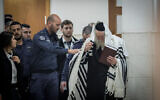 Rabbi Eliezer Berland arrives for a hearing at the Jerusalem District court on February 28, 2020. (Yonatan Sindel/Flash90)