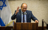 Yamina leader Naftali Bennett speaks from the rostrum in the Knesset plenum on August 24, 2020. (Oren Ben Hakoon/Pool/Flash90)