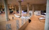 Passengers walk in the arrivals hall at the Ben Gurion International Airport near Tel Aviv on March 8, 2021. (Avshalom Sassoni/ Flash90)