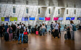 Travelers in the departures hall at Ben Gurion Airport on April 18, 2021. (Yossi Aloni/Flash90)