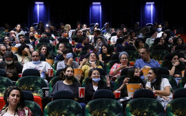Israelis attend a movie at the Cinema City theatre in Jerusalem on May 27, 2021. (Olivier Fitoussi/Flash90) Israelis attend a movie at the Cinema City theatre in Jerusalem on May 27, 2021. (Olivier Fitoussi/Flash90)