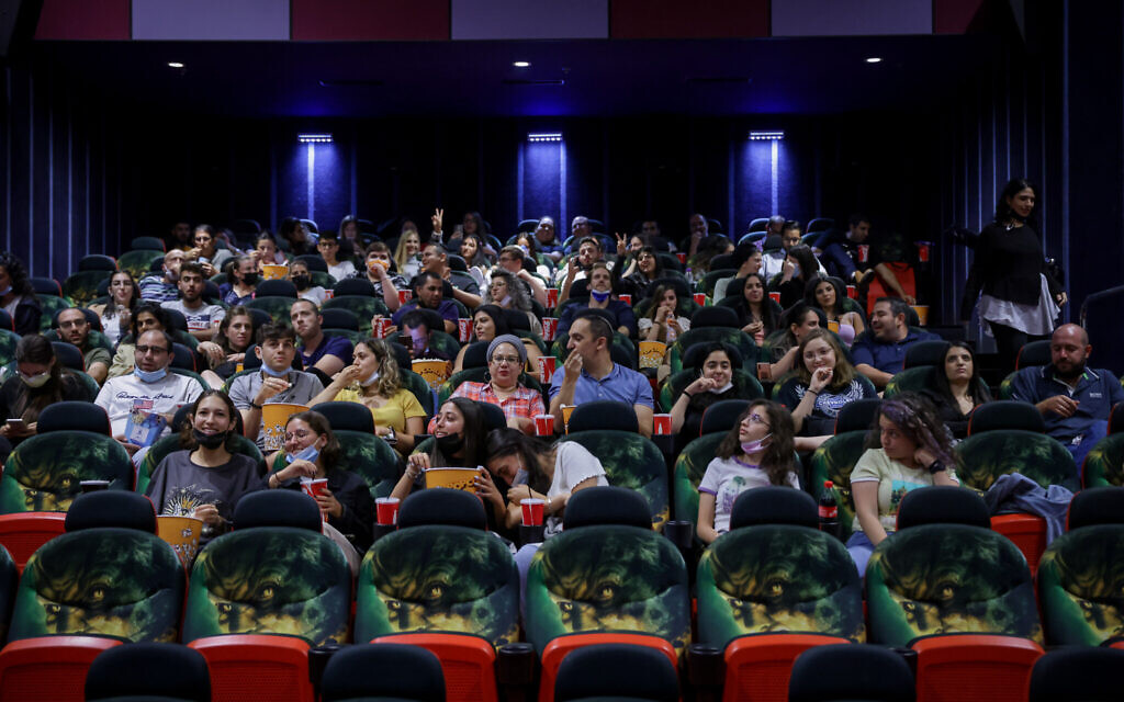 Israelis attend a movie at Jerusalem's Cinema City movie theatre on May 27, 2021, the official reopening night after14 months of closure during the coronavirus pandemic (Olivier Fitoussi/Flash90)