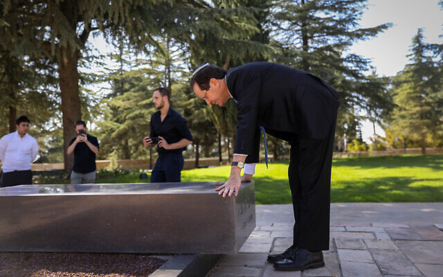Then-president-elect Isaac Herzog visits the grave of his father, former president Chaim Herzog, at Mount Herzl national cemetery in Jerusalem, June 2, 2021. (Noam Revkin Fenton/Flash90) Then-president-elect Isaac Herzog visits the grave of his father, former president Chaim Herzog, at Mount Herzl national cemetery in Jerusalem, June 2, 2021. (Noam Revkin Fenton/Flash90)