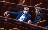 New Hope MK Zeev Elkin (L) seen in the plenum hall of the Israeli parliament during the voting in the presidential elections, in Jerusalem, June 2, 2021. (Olivier Fitoussi/ Flash90)