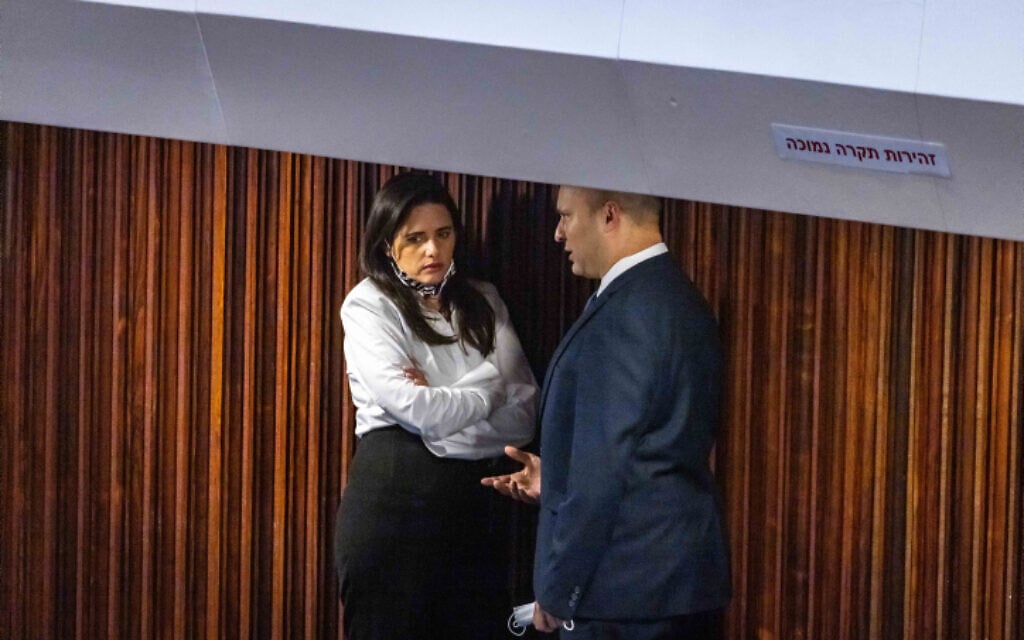 Naftali Bennett, right, and Ayelet Shaked seen in the Knesset plenum during voting for the president in Jerusalem on June 2, 2021. (Olivier Fitoussi/Flash90)
