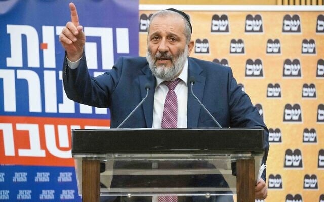 Shas head Aryeh Deri gives a press statement (together with UTJ MK Moshe Gafni and Yaakov Litzman) at the Knesset, June 8, 2021. (Yonatan Sindel/Flash90)