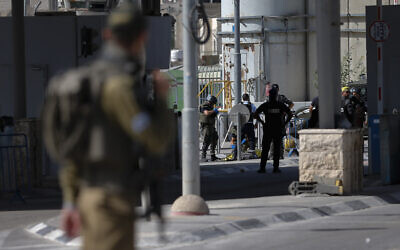 Israeli security forces guard after a Palestinian woman was shot, at the Qalandiya Checkpoint near Jerusalem, June 12, 2021. (Jamal Awad/Flash90)