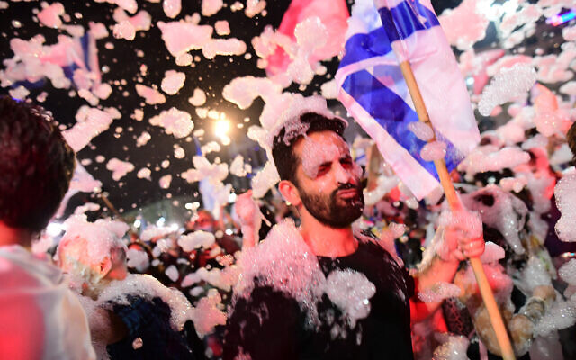 Israelis celebrate the change government at Rabin Square in Tel Aviv on June 13, 2021. (Tomer Neuberg/FLASH90)