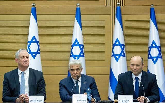 Prime Minister Naftali Bennett (R), Foreign Minister Yair Lapid (C) and Defense Minister Benny Gantz attend the first cabinet meeting, at the Knesset on June 13, 2021. (Yonatan Sindel/Flash90) Prime Minister Naftali Bennett (R), Foreign Minister Yair Lapid (C) and Defense Minister Benny Gantz attend the first cabinet meeting, at the Knesset on June 13, 2021. (Yonatan Sindel/Flash90)