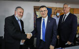 Then-newly appointed Justice Minister Gideon Sa'ar with Attorney General Avichai Mandelblit (left) and then-outgoing minister of justice Benny Gantz (right) at a ceremony marking the change of minister, at the Ministry for Justice in Jerusalem on June 14, 2021. (Olivier Fitoussi/Flash90)
