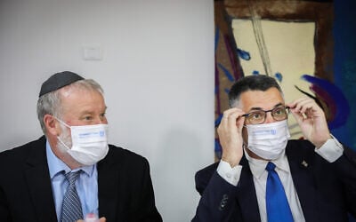 Attorney General Avichai Mandelblit (left) with Gideon Sa'ar at a ceremony in Jerusalem, on June 14, 2021. (Olivier Fitoussi/Flash90)