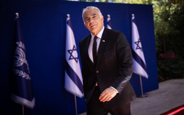 Foreign Minister Yair Lapid arrives to the President's Residence in Jerusalem, for a group photo of the newly sworn in Israeli government, June 14, 2021.(Yonatan Sindel/Flash90) Foreign Minister Yair Lapid arrives to the President's Residence in Jerusalem, for a group photo of the newly sworn in Israeli government, June 14, 2021.(Yonatan Sindel/Flash90)