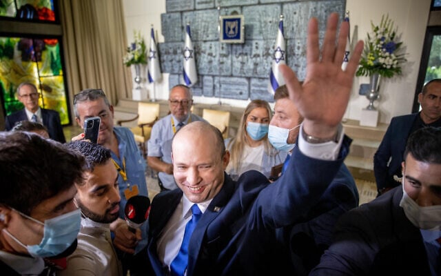 Prime Minister Naftali Bennett arrives for a group photo of the new Israeli government at the President's Residence in Jerusalem on June 14, 2021 (Yonatan Sindel/FLASH90) Prime Minister Naftali Bennett arrives for a group photo of the new Israeli government at the President's Residence in Jerusalem on June 14, 2021 (Yonatan Sindel/FLASH90)