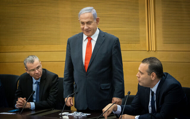 Former prime minister Benjamin Netanyahu leads a meeting of the right-wing and religious opposition parties at the Knesset, June 14, 2021. At left is Likud MK Yariv Levin; at right is Likud former coalition chief MK MIki Zohar (Yonatan Sindel/Flash90) Former prime minister Benjamin Netanyahu leads a meeting of the right-wing and religious opposition parties at the Knesset, June 14, 2021. At left is Likud MK Yariv Levin; at right is Likud former coalition chief MK MIki Zohar (Yonatan Sindel/Flash90)