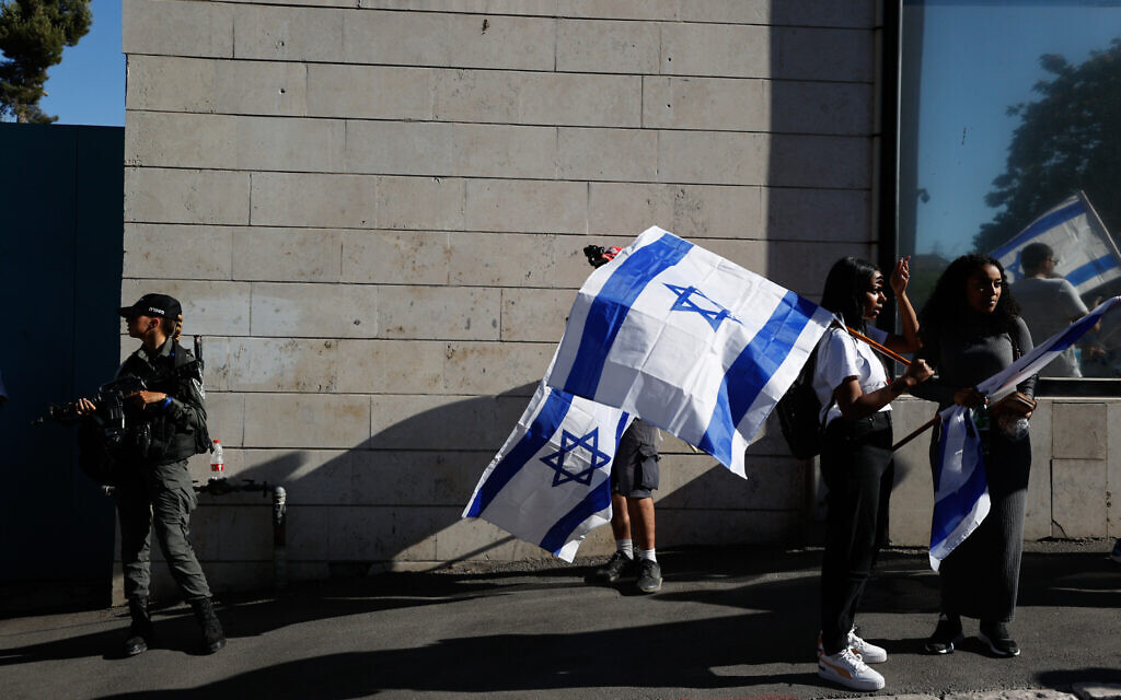 People with Israeli flags during the March of Flags near Jerusalem's Old City, June 15, 2021. (Yonatan Sindel/Flash90)